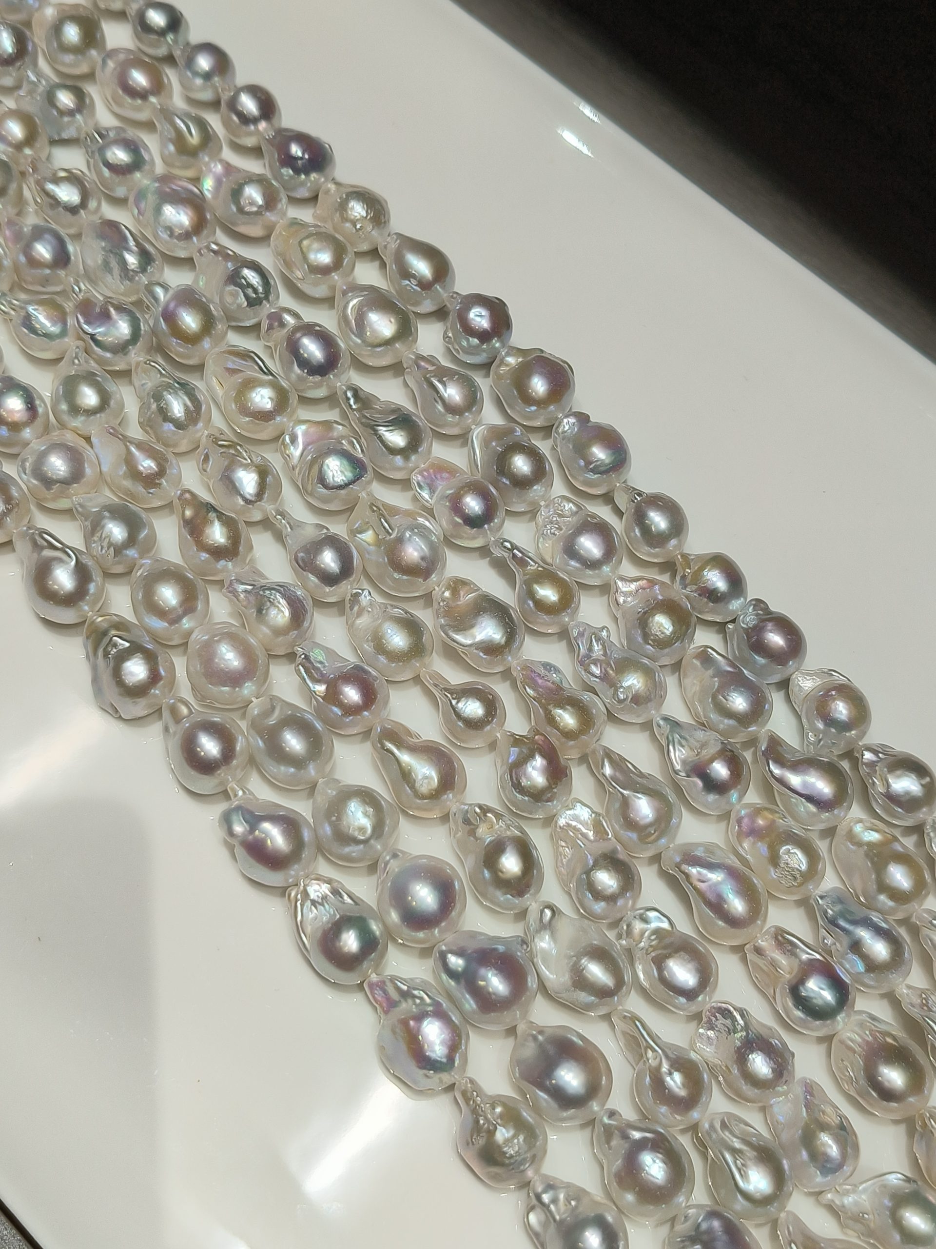 aaa high luster baroque pearl strands smooth surface