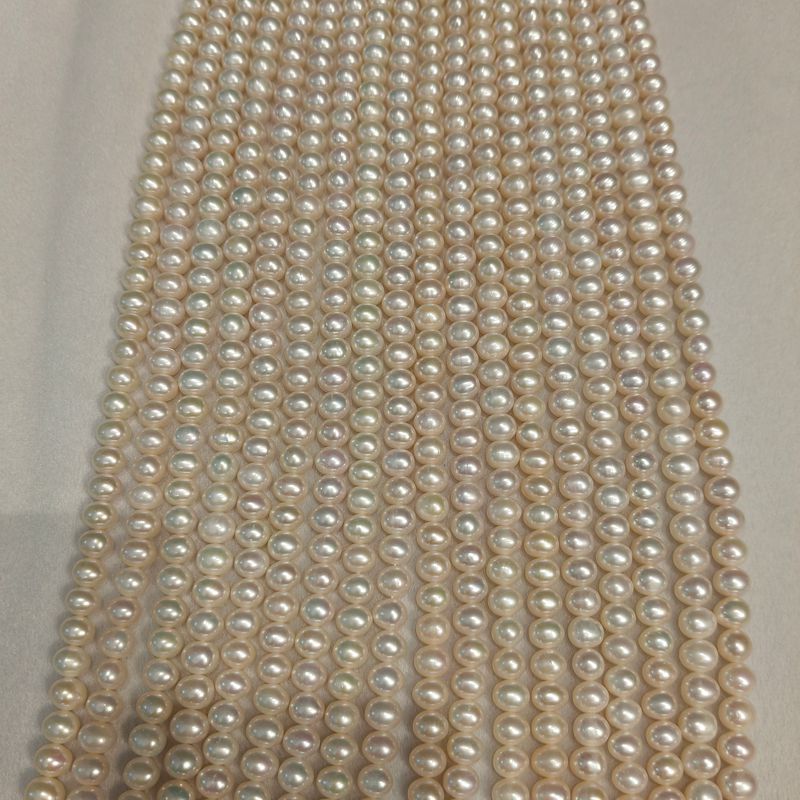 aaa high luster oval pearl strands smooth surface