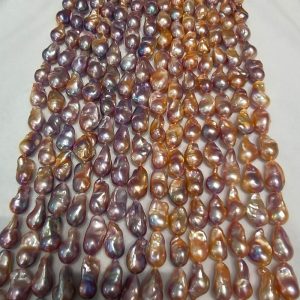 Deep purple baroque freshwater pearl strands with strong metallic luster and smooth surface
