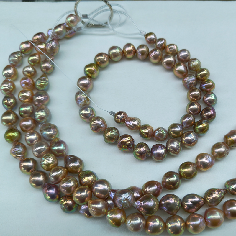 high luster edison pearls in mixed shapes with metallic overtone