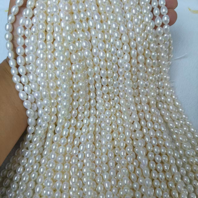 high luster white rice pearl strands smooth surface
