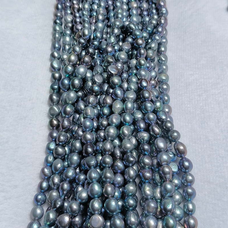 Organic nugget texture of gray pearl strands ideal for bespoke gray pearl jewelry