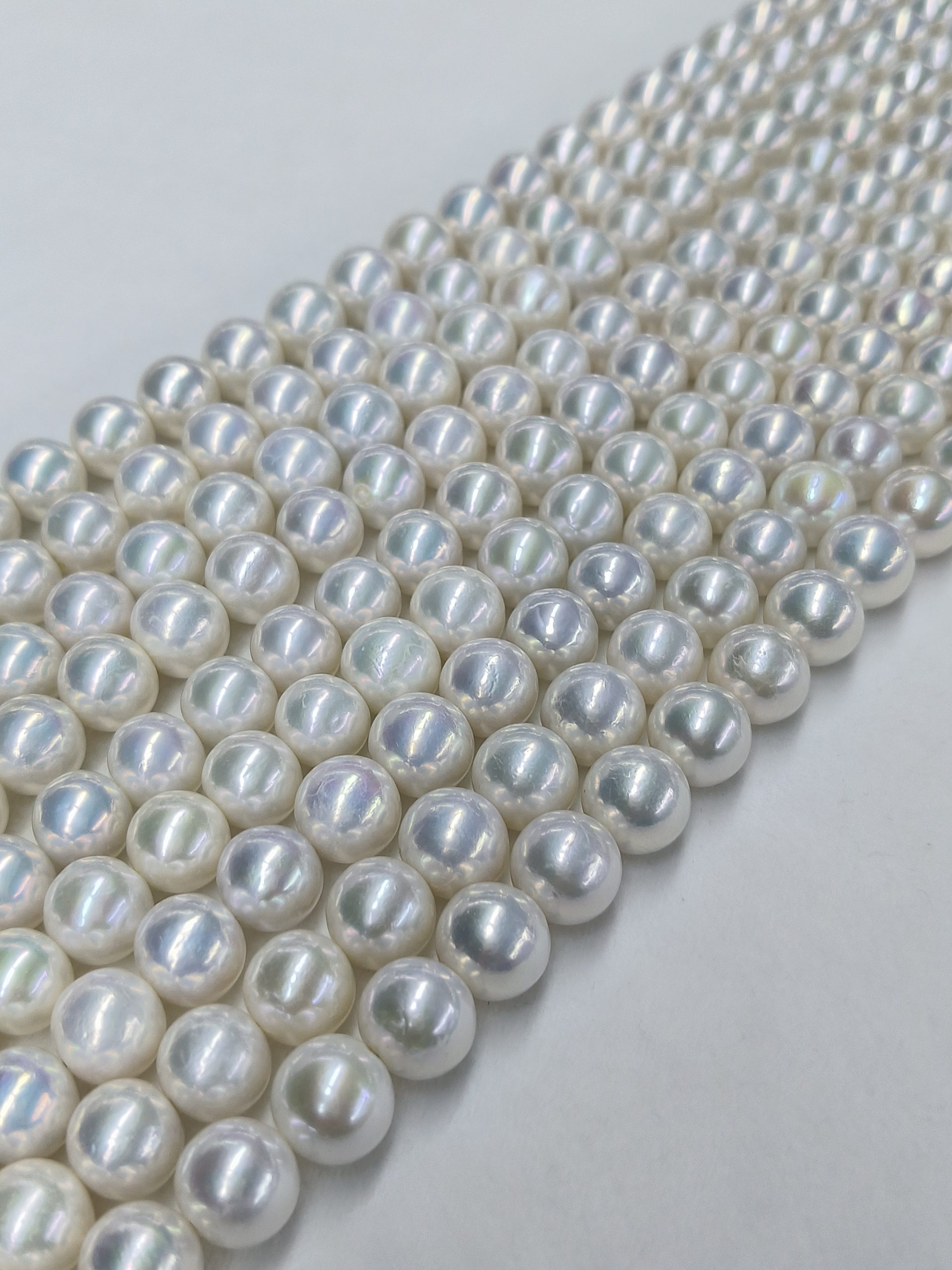 High luster round edison pearls with subtle blue overtone