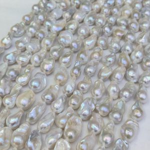 white baroque freshwater pearl strands with flameball shape