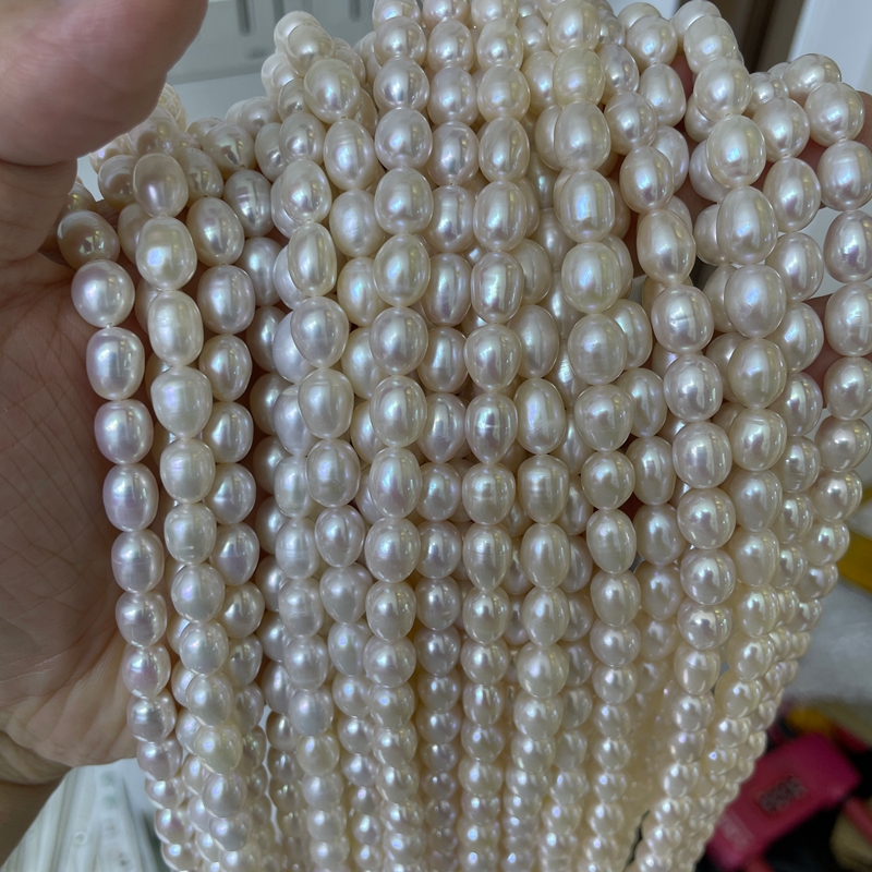 high luster rice pearl strands smooth surface