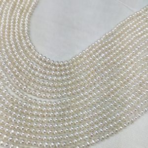 A temporary 16-inch strand of 4mm natural white potato round pearls, ready for creating dainty small pearl necklaces.