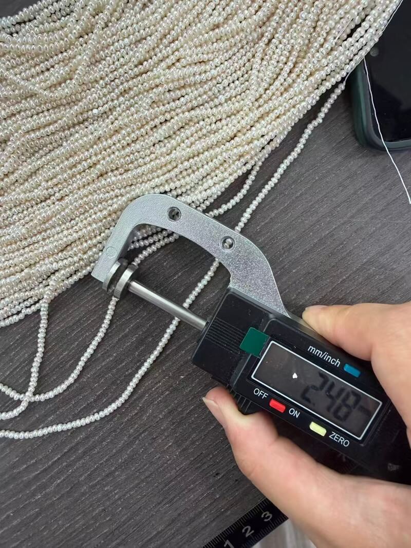 Digital caliper measuring 2-2.5mm mini seed pearl necklace strands for wholesale