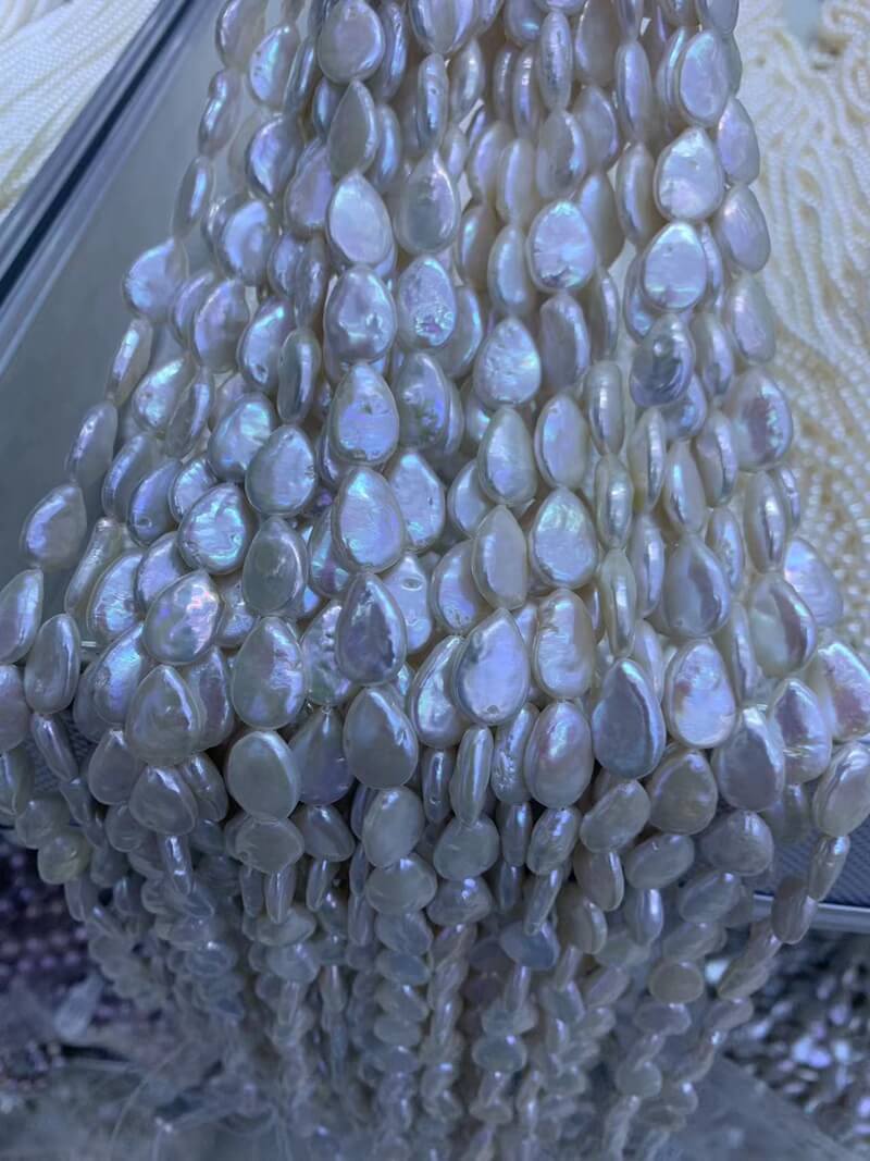 Wholesale 9x12mm flat teardrop baroque pearls for creating statement pearl drop earrings.