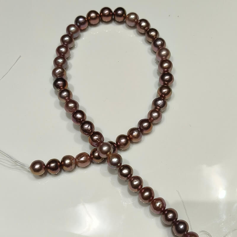 Affordable dark Edison pearl strands in deep purple with high metallic luster for wholesale.