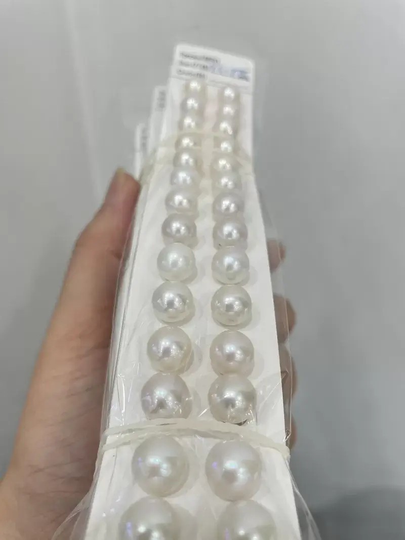 Budget-friendly 9mm to 10mm white round loose freshwater pearls with clean front face