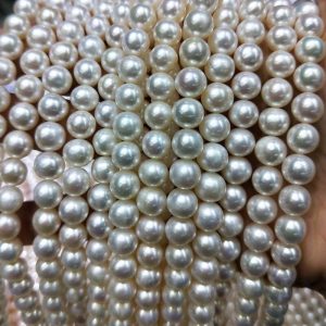Large inventory stock of 8mm classic white freshwater cultured pearl loose stones strands, prepared for high-volume custom pearl necklace wholesale orders.