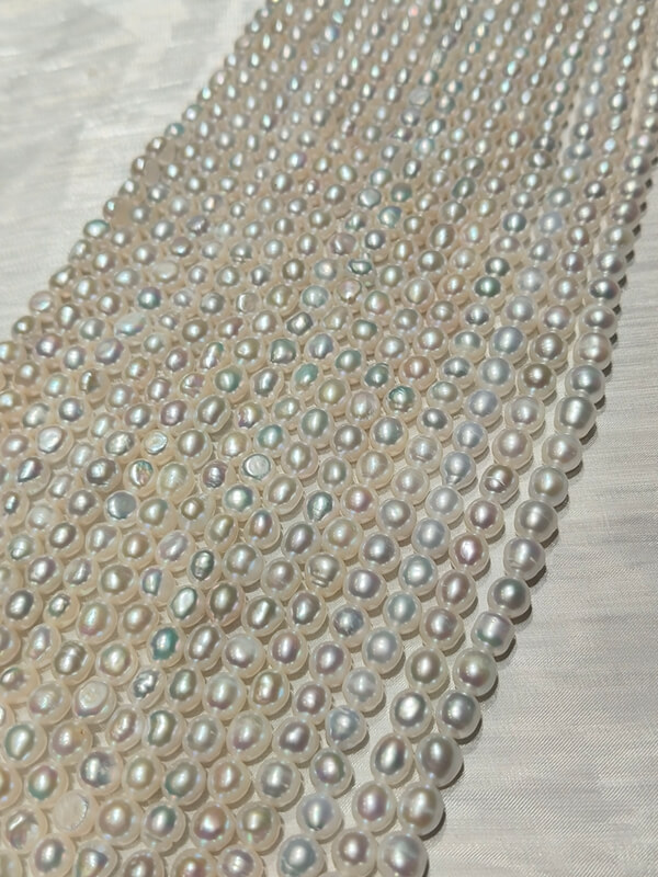 Bulk natural freshwater nugget pearl strands from a direct wholesale vendor, top bead supply for independent jewelry designer brands.