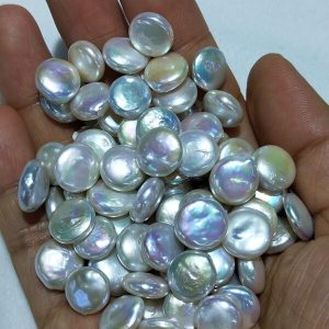 Grading standard comparison of high luster cultured coin pearls from commercial to AAA grade.