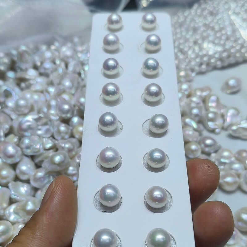 A batch of 10 pairs of matching 10-11mm Edison pearls organized for wholesale order, meeting the minimum order quantity.