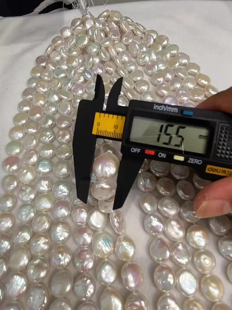 Bulk stock of large 14-15mm coin pearl strands directly from China freshwater pearl manufacturer.