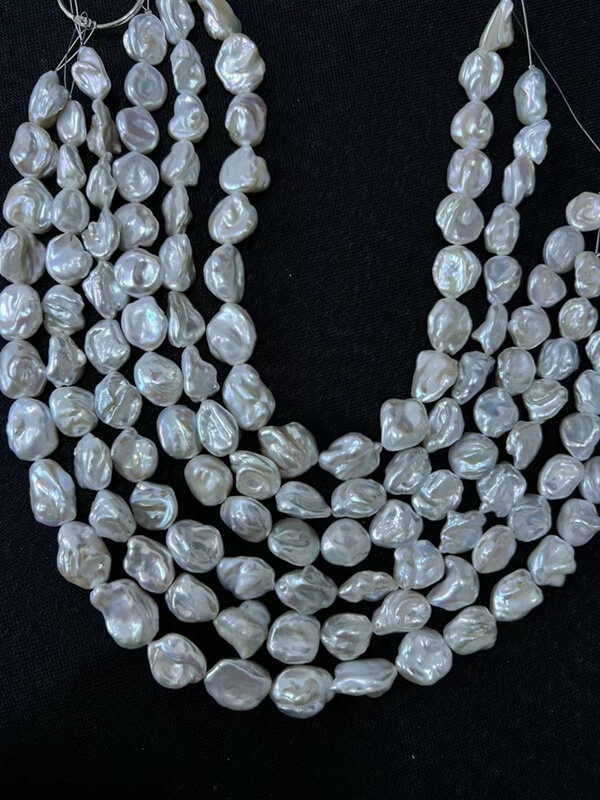 Natural white irregular Keshi baroque pearl strands showing high luster mirror surface for jewelry designers