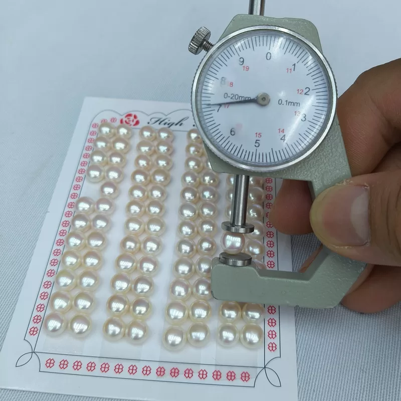 Wholesale card of 48 pairs (96 pearls) 7mm high-luster, natural white freshwater button pearls, half-drilled and ready for making classic pearl wedding earrings.