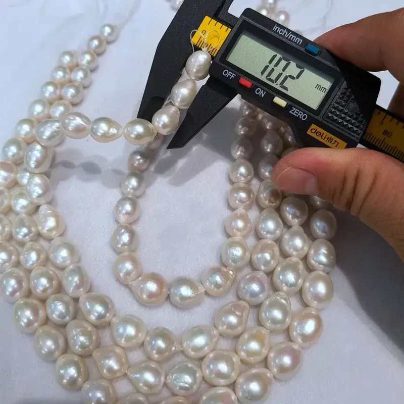 Premium high luster 11-13mm teardrop edison pearls loose strands in bulk for independent designers.