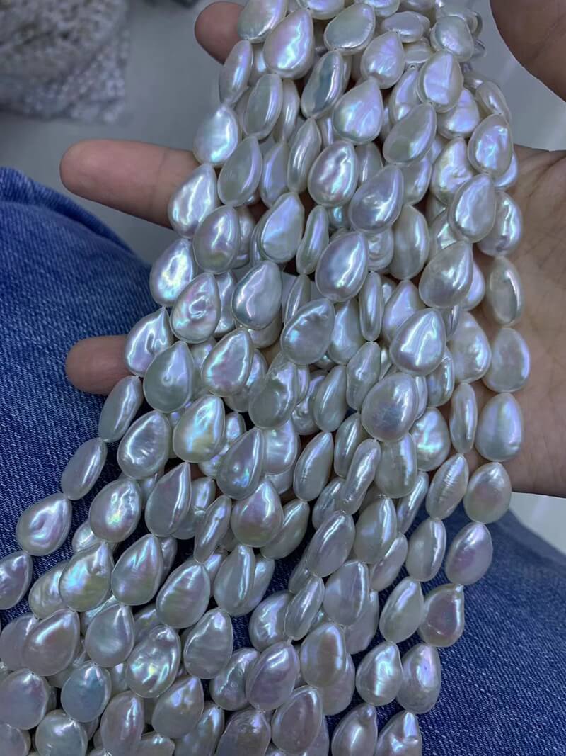 A matched pair of high luster flat teardrop baroque freshwater pearls for jewelry makers.