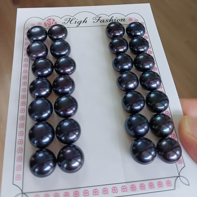 Wholesale supply of rare jumbo-sized 12mm peacock black button freshwater pearls pre-matched in pairs for premium luxury stud earring collections.
