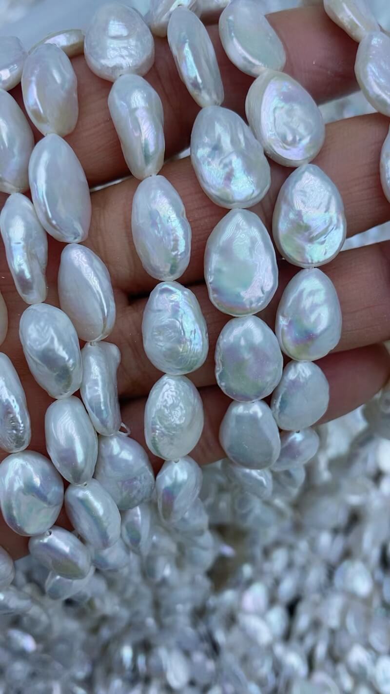Sleek and lightweight irregular flat teardrop pearls, perfect for independent earring designers.