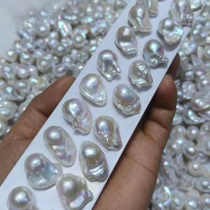 Premium irregular baroque pearl pairs with pink and green metallic overtones ready for custom studio earrings.