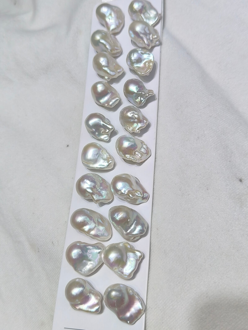 Matched pairs of unique monster baroque pearls showing exceptional metallic orient and luster.
