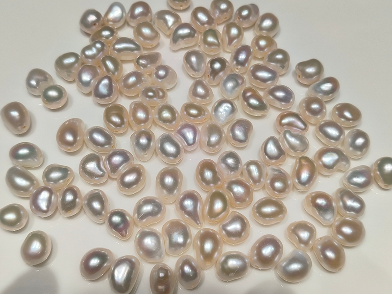 High metallic luster loose baroque pearls in organic bean shape with rainbow iridescent overtones