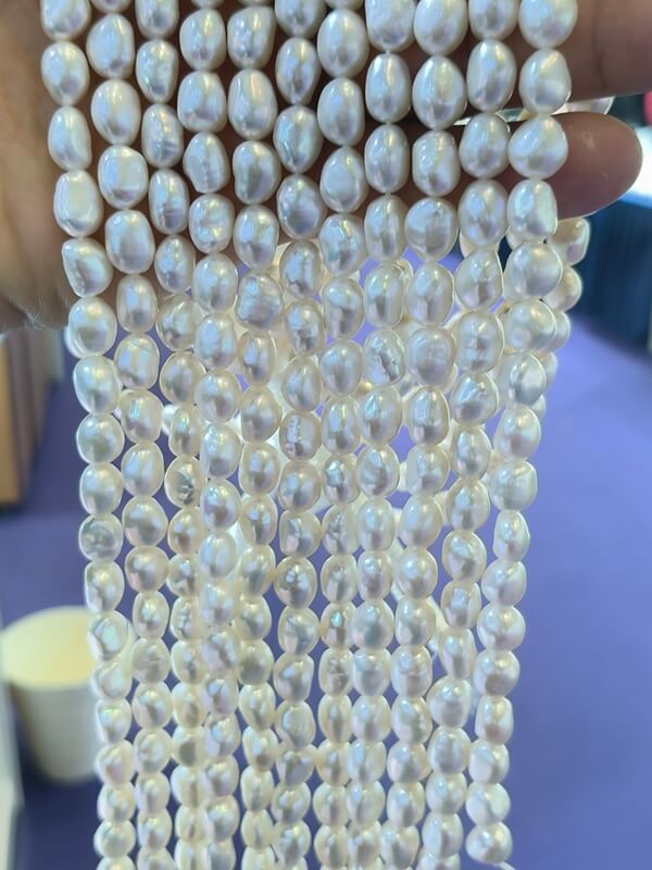 Top quality 10-11mm white nugget pearls with high luster and clean surface