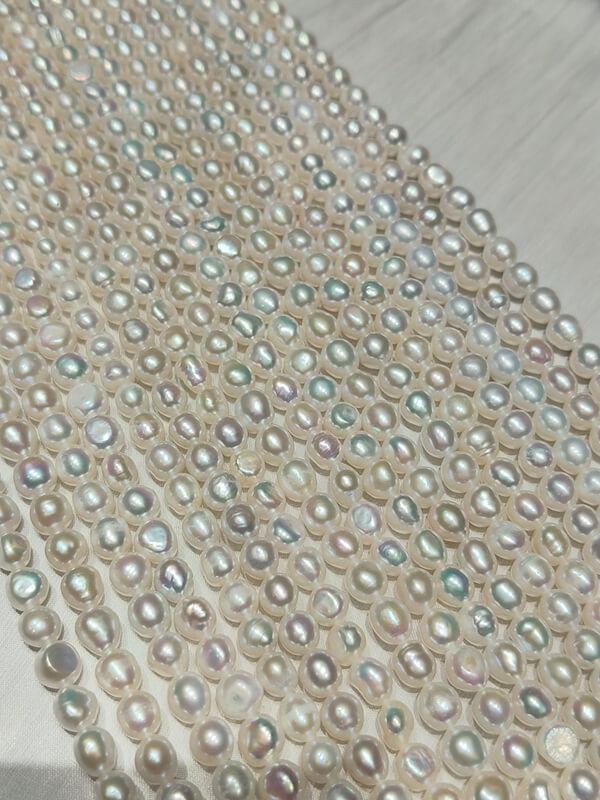 Center-drilled nugget cultured pearl necklace strands with mirror-like luster, perfect loose bead supply for handmade gemstone jewelry designs.