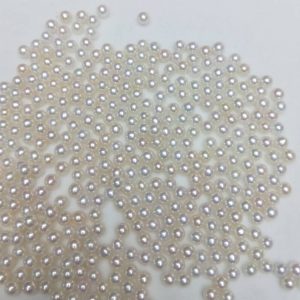 Bulk wholesale 4-5mm high luster undrilled freshwater seed pearls loose beads for jewelry suppliers.