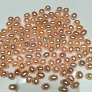 Precision half drilled peach pink drop pearl beads with 0.8mm top-drilled hole optimized for peg settings
