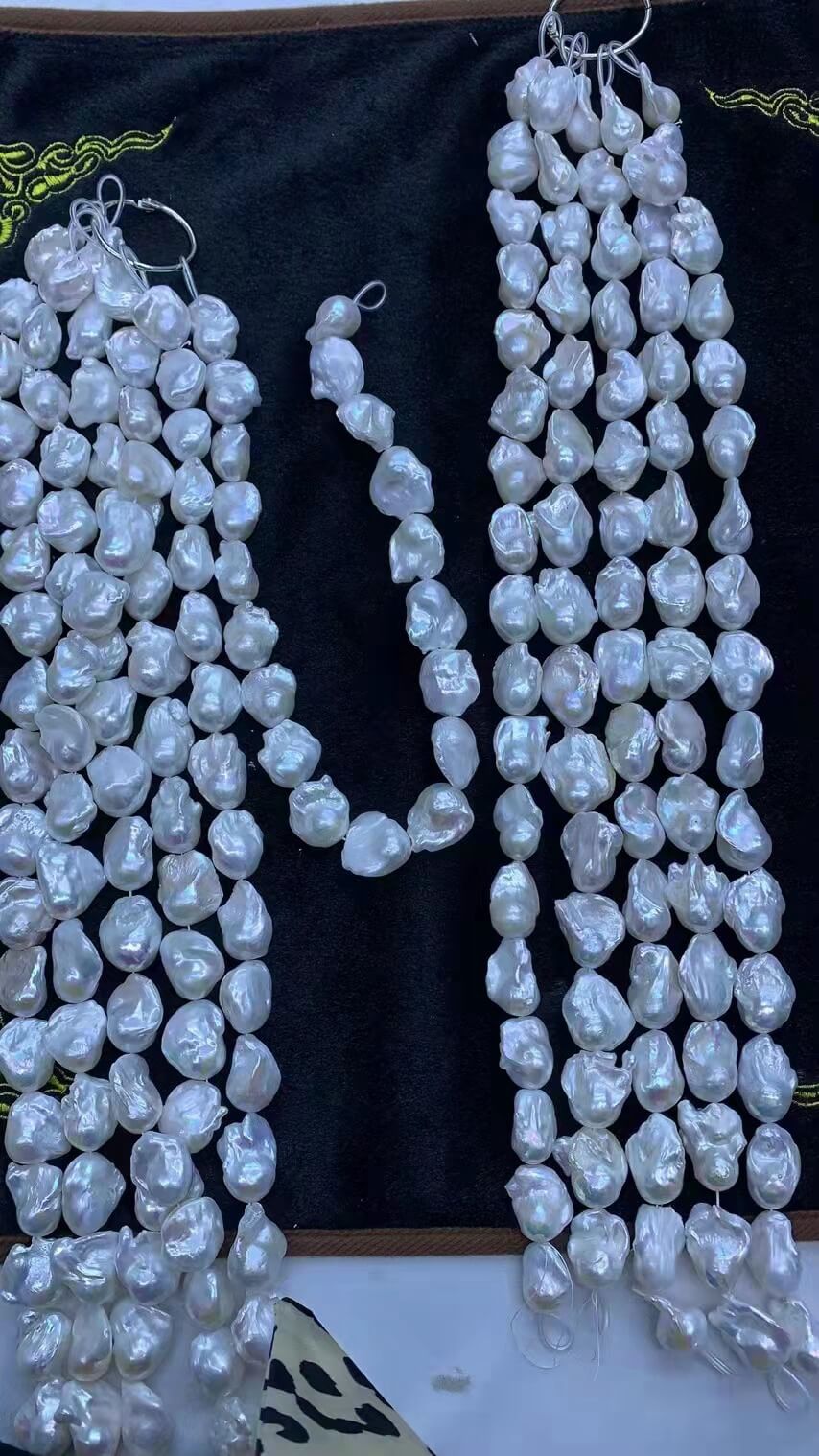 Premium quality loose white baroque pearl strands for jewelry making, ideal material for chunky pearl necklace statement designs.