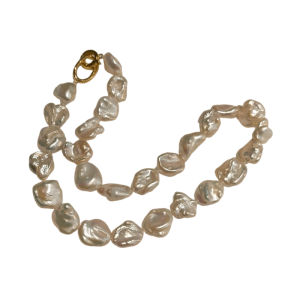 Close-up of AAA grade natural keshi pearl necklace showing mirror-like metallic luster.