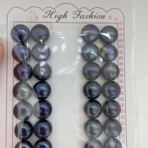 Rare jumbo-sized 12-13mm peacock black button freshwater pearl pairs with high metallic luster for wholesale statement earring designs.
