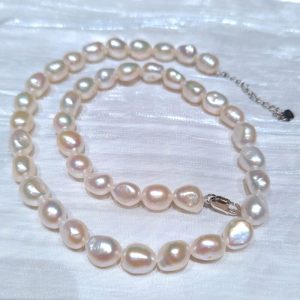 Natural white pearl choker necklace in 10mm-11mm nugget shape, premium luster freshwater pearls available in bulk for jewelry layering collections.