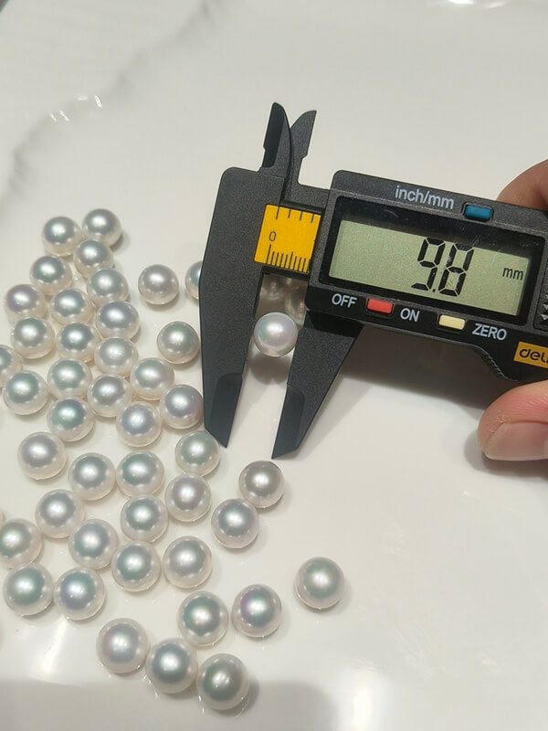 A cluster of flawless white Edison round pearls with mirror luster, left completely undrilled to support advanced interchangeable and detachable pearl ring designs.