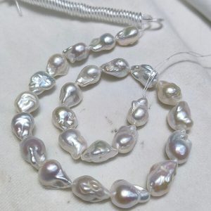 Wholesale 13-15mm plump white baroque pearl strand with high luster and uniform sizing for statement necklaces.