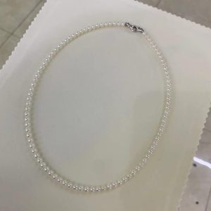 Bulk supply of 4mm AAA round freshwater pearl choker necklaces from a direct China lakes manufacturer, customizable with custom lengths and yellow gold clasps.