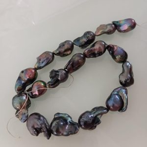 Center full-drilled 15-28mm massive black baroque pearls ready for custom jewelry wire-wrapping.