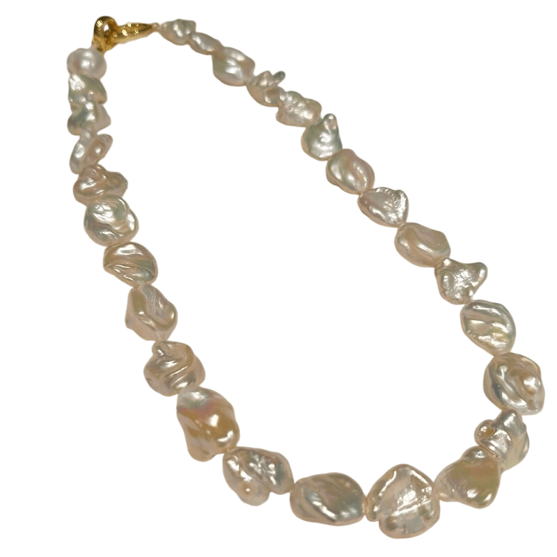 Finished high-luster freshwater baroque keshi pearl necklace with gold clasp for wholesale jewelry boutiques.