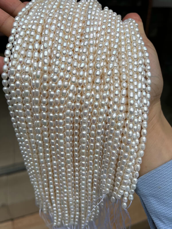 Fine quality unknotted mini rice pearl strands perfect for creating delicate women's layering necklaces.