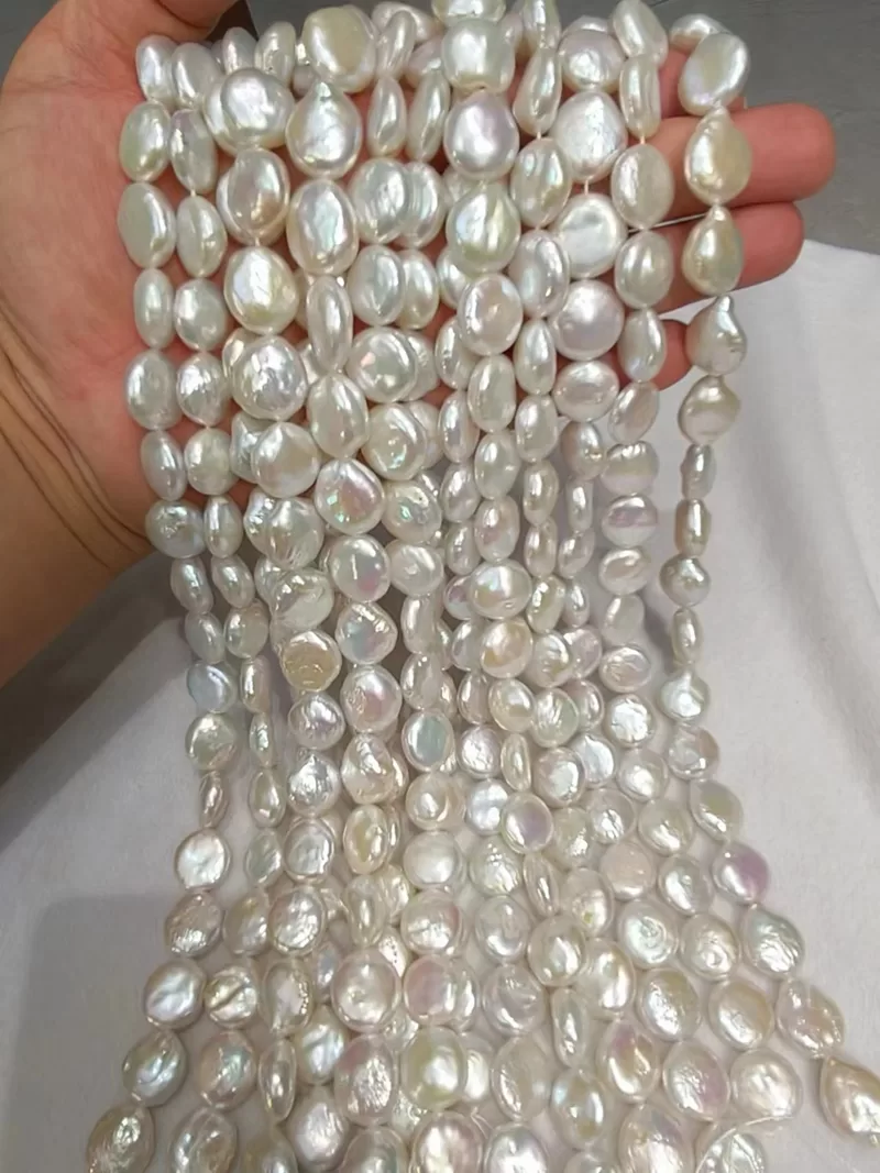 Wholesale 14-15mm white coin shaped freshwater cultured pearl loose strands for contemporary jewelry design.